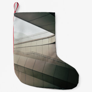 WHITE CONCRETE STAIRS WITH GRAY METAL RAILINGS SMALL CHRISTMAS STOCKING