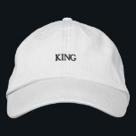 White Cotton Hat with Bold King Text Beautiful Cap<br><div class="desc">Step into your kingdom with this white cap,  featuring embroidered "King" text in bold black. Designed with breathable cotton,  it’s a stylish addition to any outfit,  with an adjustable strap for a personalized fit.</div>