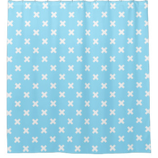 White cross stitches on baby blue