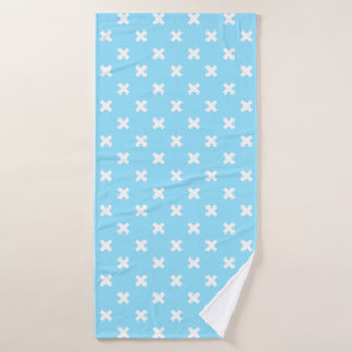 White cross stitches on baby blue bath towel