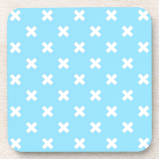 White cross stitches on baby blue coaster