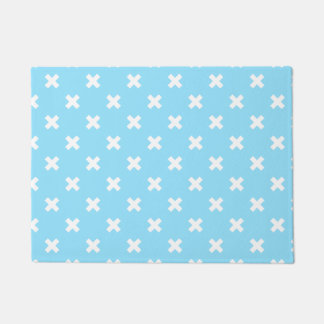 White cross stitches on baby blue doormat