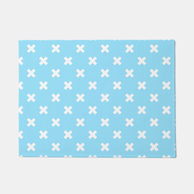 White cross stitches on baby blue doormat (Front)