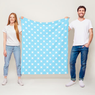 White cross stitches on baby blue fleece blanket