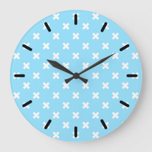 White cross stitches on baby blue large clock
