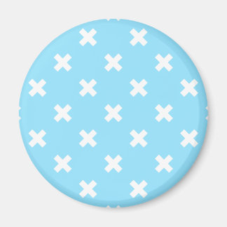 White cross stitches on baby blue magnet