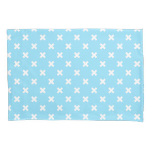 White cross stitches on baby blue pillowcase