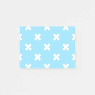 White cross stitches on baby blue post-it notes