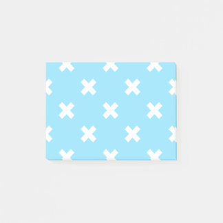 White cross stitches on baby blue post-it notes