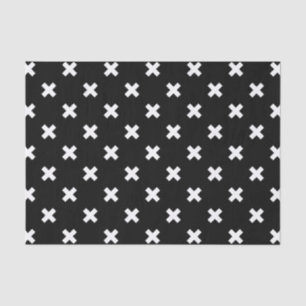 White cross stitches on black tissue paper
