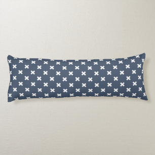 White cross stitches on blue-grey body pillow