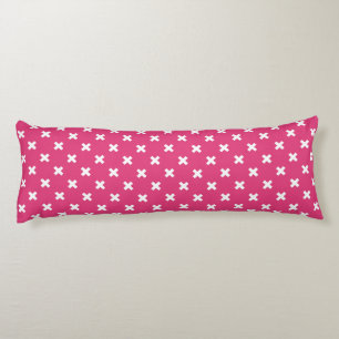 White cross stitches on fuchsia body pillow