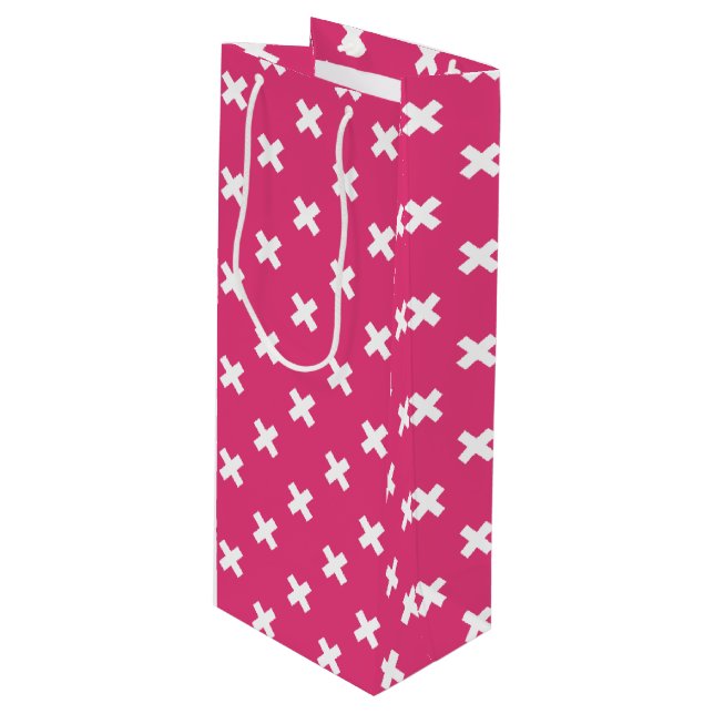 White cross stitches on fuchsia wine gift bag (Front Angled)