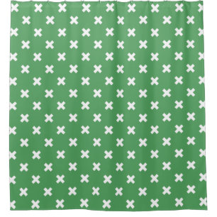 White cross stitches on green
