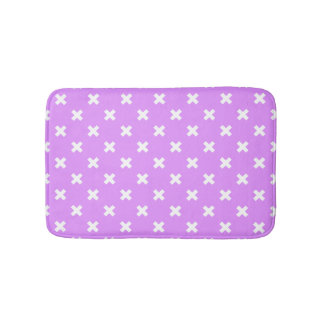 White cross stitches on lilac bath mat