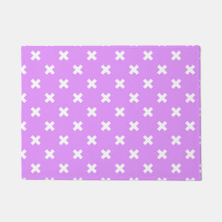 White cross stitches on lilac doormat