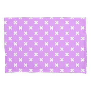 White cross stitches on lilac pillowcase