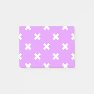 White cross stitches on lilac post-it notes