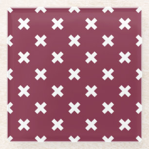White cross stitches on mulberry glass coaster