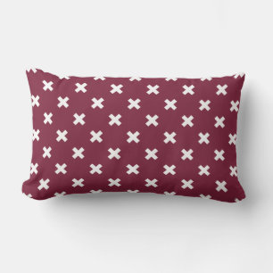 White cross stitches on mulberry lumbar pillow