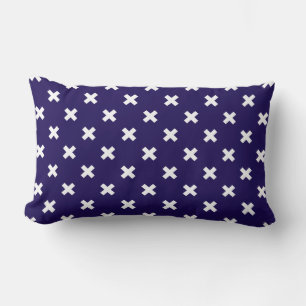 White cross stitches on navy blue lumbar pillow