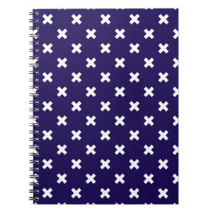 White cross stitches on navy blue notebook