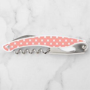 White cross stitches on peach corkscrew