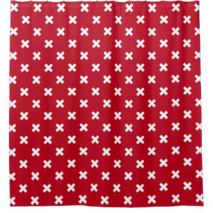 White cross stitches on red