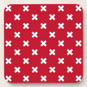 White cross stitches on red coaster