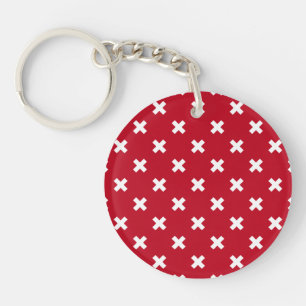 White cross stitches on red keychain