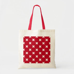 White cross stitches on red tote bag