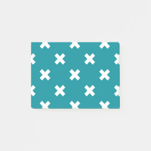 White cross stitches on teal post-it notes