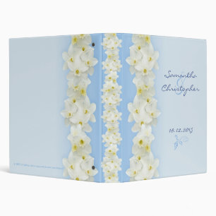 White daffodils on blue binder