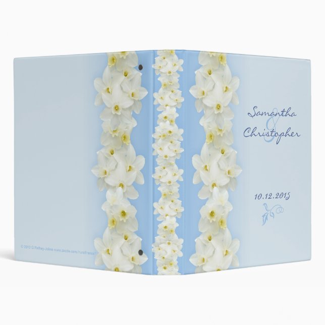 White daffodils on blue binder (Background)