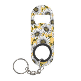 White daisies, wild flowers on yellow keychain bottle opener
