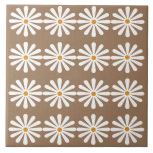 White daisies with yellow centres on sorrell brown tile