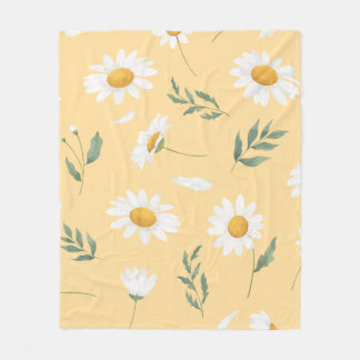 white daisies with yellow centres scattered across fleece blanket