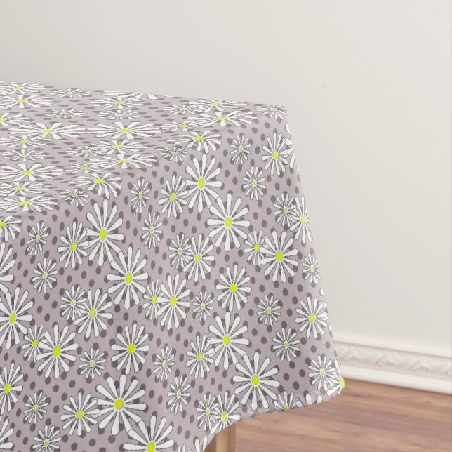 White daisy flowers on a beige brown polka dot tablecloth (In Situ)