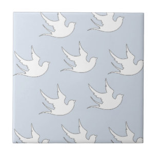 white doves on blue tile