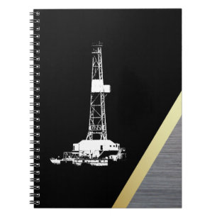 White Drilling Rig Silhouette on Black and Metal Notebook