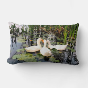 White ducks, lily pads, cattails, lake shore lumbar pillow