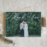 White Elegant Script Photo Wedding Thank You Postcard<br><div class="desc">Send thanks to family and friends with this customizable wedding thank you postcard. It features an elegant white script. Personalize this elegant wedding thank you postcard by adding your own details. This script thank you postcard will also be perfect for graduations,  birthdays,  first communions,  and so much more.</div>