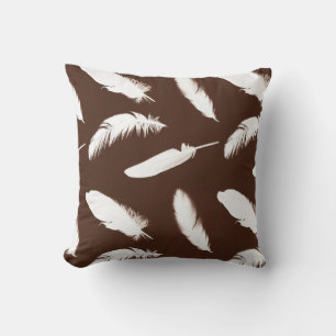 White feather print on chocolate brown throw pillow