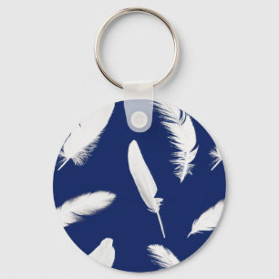 White feather print on dark blue keychain