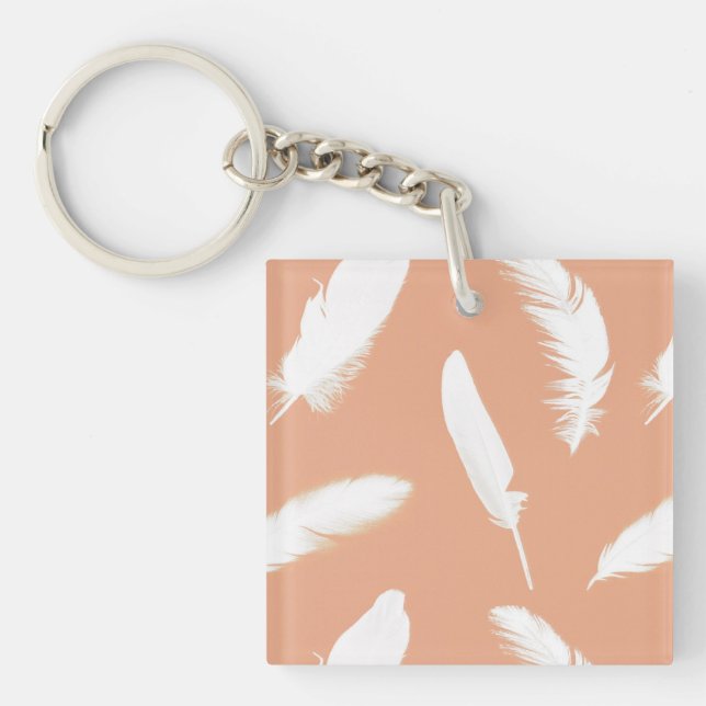 White feather print on soft peach keychain (Front)