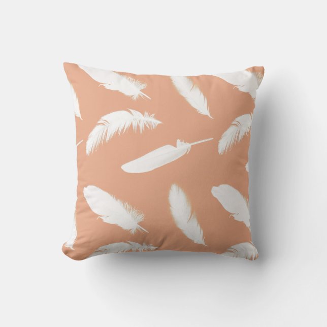 White feather print on soft peach throw pillow (Front)