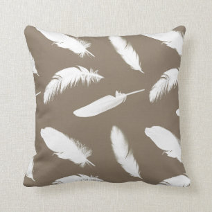 White feather print on taupe throw pillow