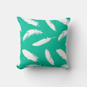 White feather print on turquoise throw pillow