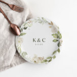 White Floral Greenery Wedding Bridal Shower Paper Plate<br><div class="desc">Bridal shower plates or dessert plates for weddings or engagement parties: Add a touch of elegance to your wedding desserts,  bridal shower,  or engagement party with these personalized paper plates. Featuring a chic greenery and white floral design with customizable initials and date,  they’re perfect for celebrating in style!</div>
