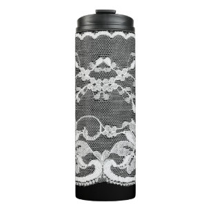 White floral lace on a black background. thermal tumbler
